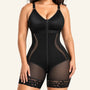Model wearing a black zip-front mid-thigh faja bodysuit with lace leg openings