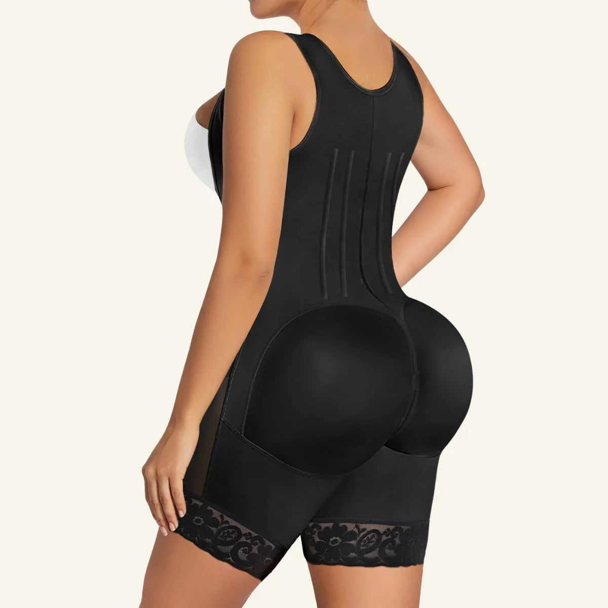 High-compression butt lifting faja bodysuit with lace hem back view in Black - SHAPERX