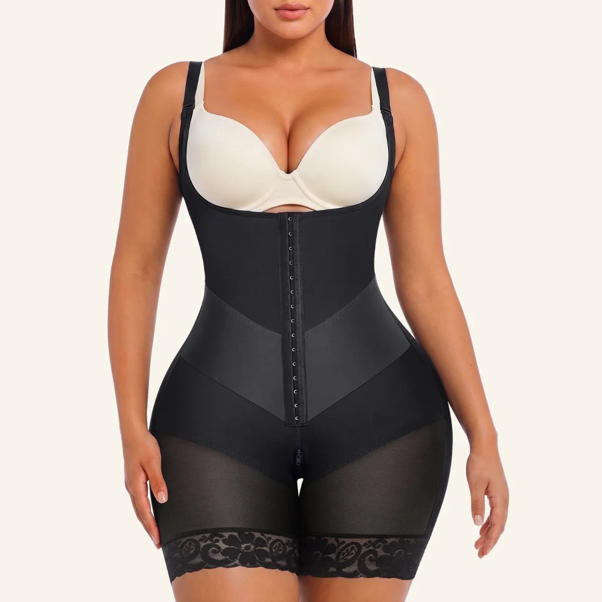 Front view of model wearing black V-shaped waist control faja bodysuit