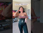Model wearing black waist trainer over shapewear bodysuit for waist shaping demonstration