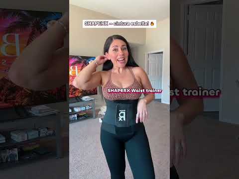 Model wearing black waist trainer over shapewear bodysuit for waist shaping demonstration