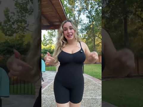 Model wearing black tummy control shapewear bodysuit with adjustable straps and shorts length